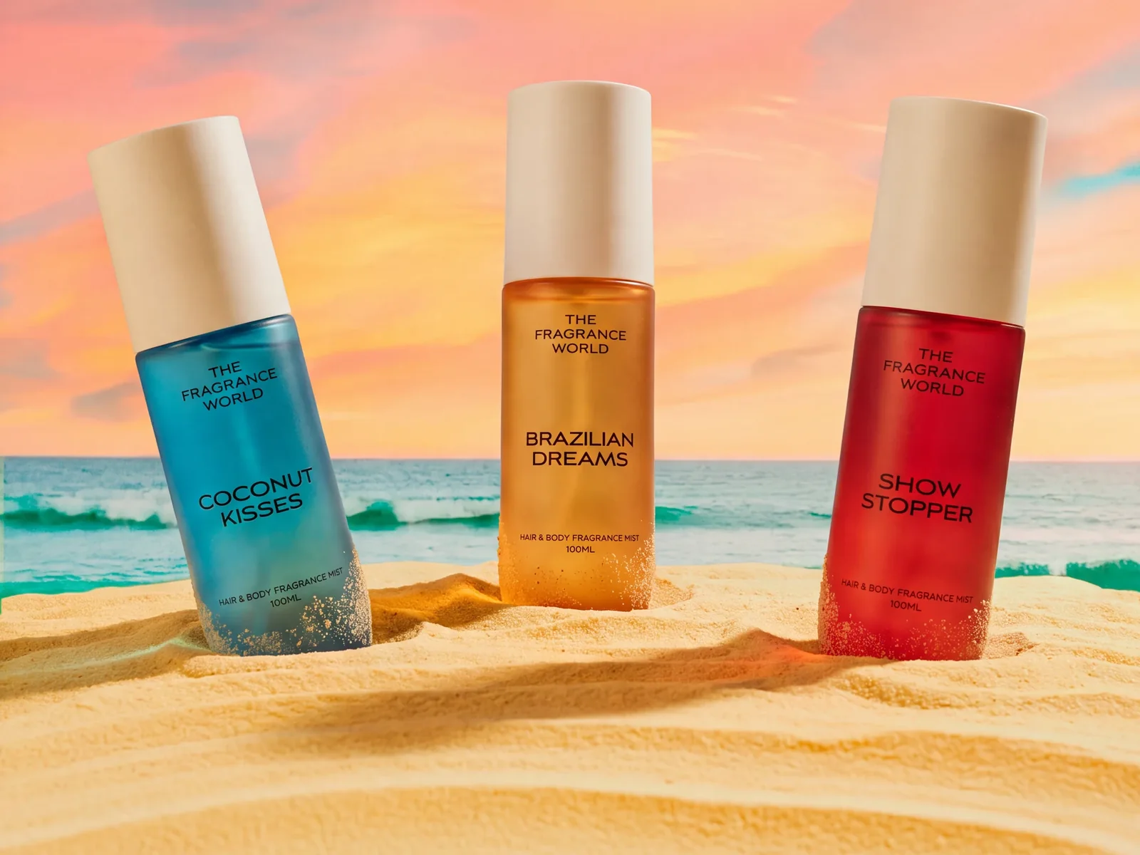 Coconut Kisses, Brazilian Dreams and Show Stopper body mists standing in beach sand at sunset