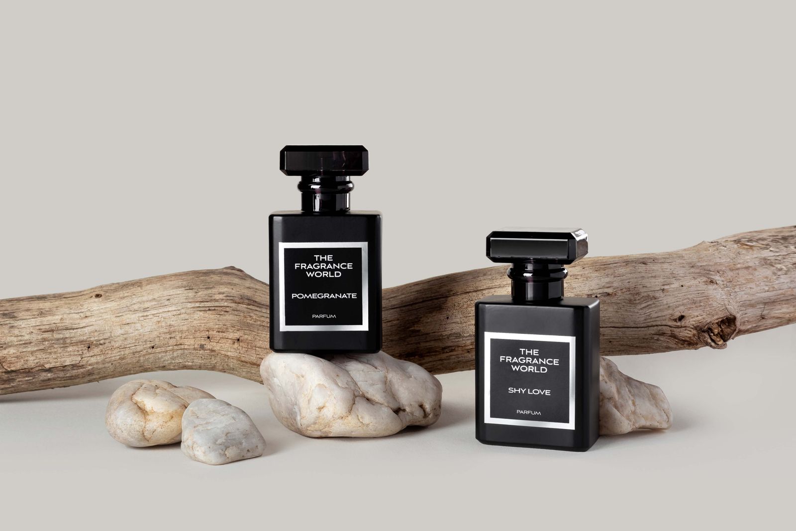 The Fragrance World bottles on natural stone